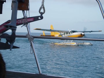 Seaplane taxiing past Sanderling after landing